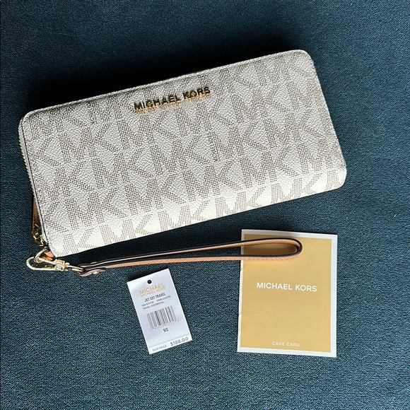 Michael Kors Handbags - MICHAEL Michael Kors
Logo Jet Set Travel Continental Cream Wristlet Wallet NWT